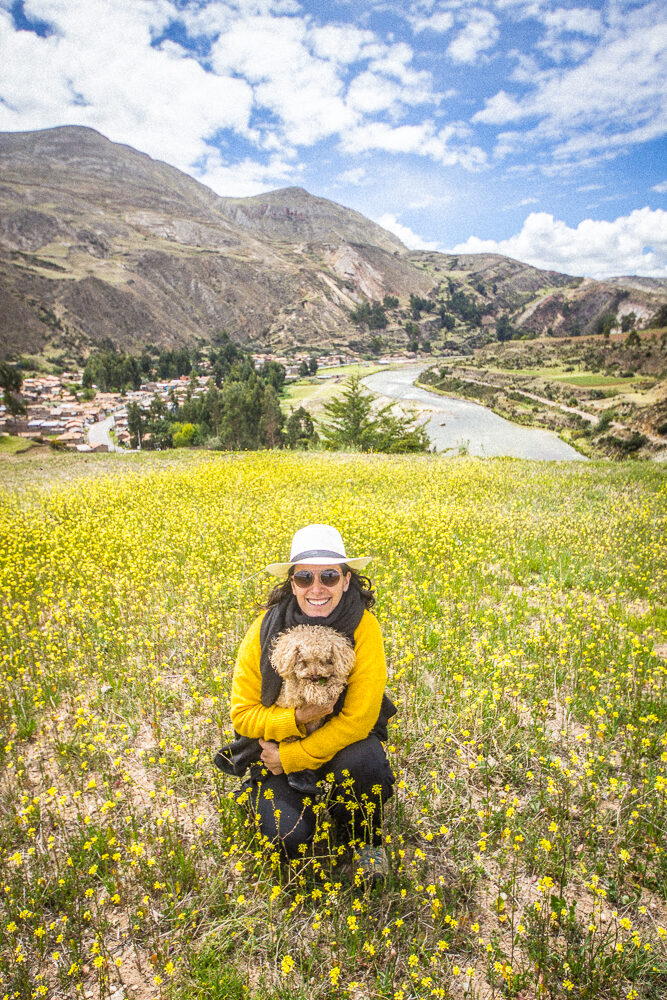 Carolina Araoz in a field of flowers in the valley